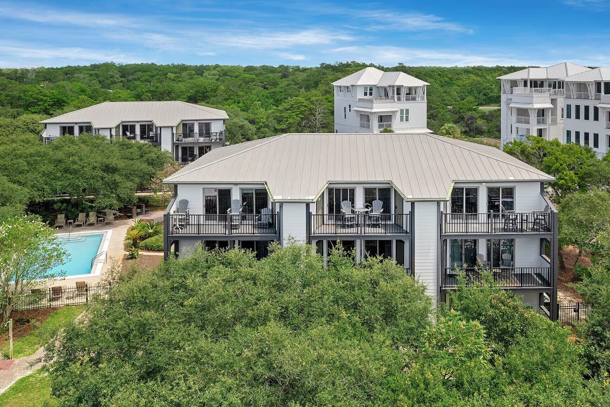 Building exterior with balconies and pool